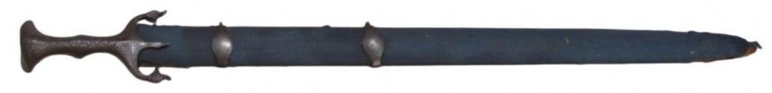 A PERSIAN BROADSWORD: Reflecting the neoclassicism of the reign of Nasr al-Din Shah, with symmetrical silver-inlaid hilt and scrolled quillons. The long, straight, double-edged blade etched overall, including Qurâ€™an