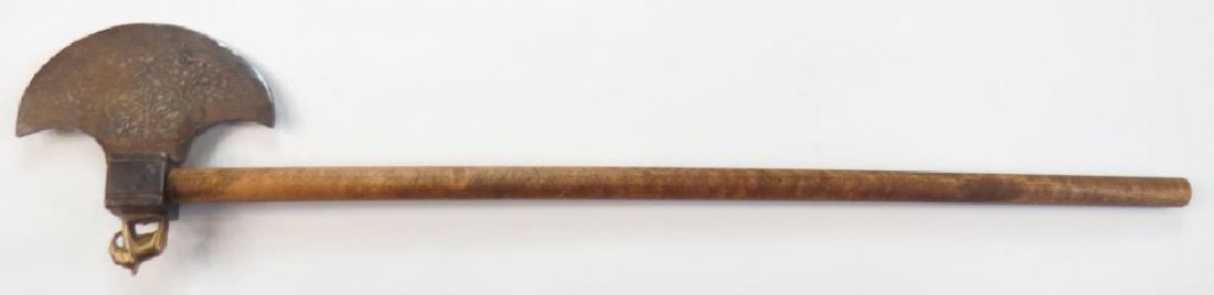 AN INDIAN DERVISH AXE: Steel head of crescent form, inlaid overall with silver. Brass pein in the form of an elephant._x000D_ On its hardwood haft. Latter 19th century. Worn. Overall length 47.7 cm._x000D_ Condition IV_x000