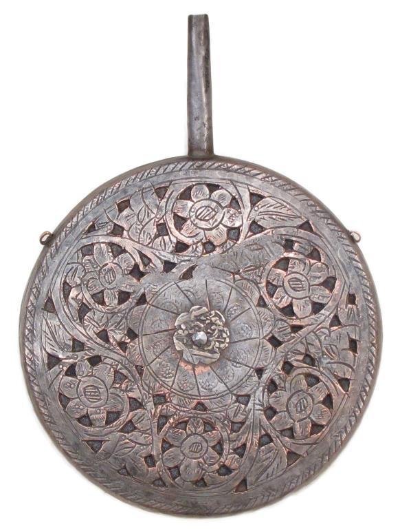 A CENTRAL ASIAN POWDER FLASK: Wrought of copper with traces of tinning, the obverse pierced and engraved overall in flowering vinework. Late 19th century. Overall length 20.7 cm. _x000D_ Condition III_x000D_