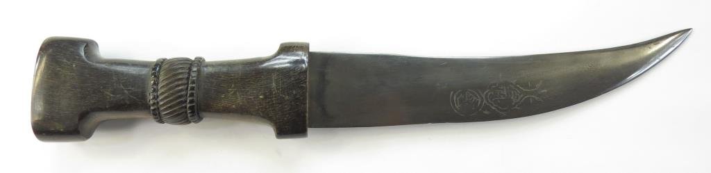 A SYRIAN KHANJAR DAGGER: With characteristic grip carved of horn, the fine blade wrought of black Persian wootz and engraved with the lion mark of Assad Allah. Latter 18th century. Light war. Overall length 33 cm._x000D_ Cond