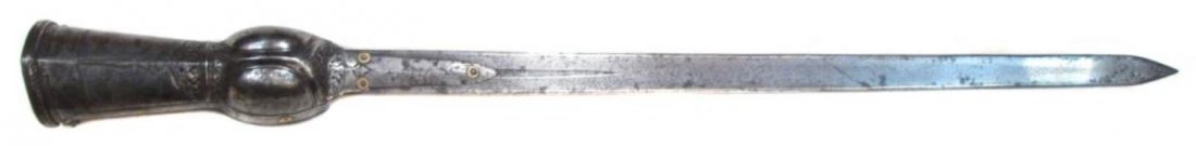 A SOUTH INDIAN PATA SWORD: A classic example of the type, forged entirely of steel. The finely-embossed gauntlet with chiseled foliate and geometrical panels, and retaining its steel wrist strap and hardwood grip. The robust bl