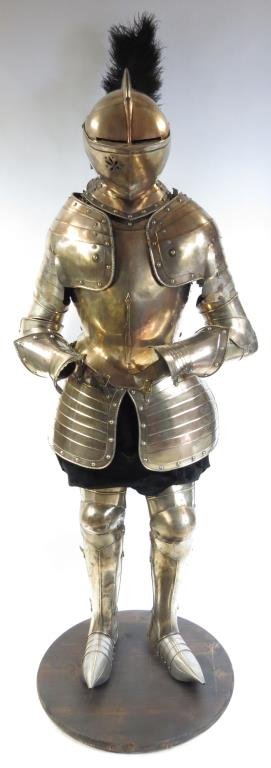 A RARE SUIT OF EGLINTON ARMOR: A fine armor wrought in copper and heavily silvered overall, made in distinctly Elizabethan style. The helmet with high comb and characteristic visor and bevor sharing a pivot, the visor pierced for v