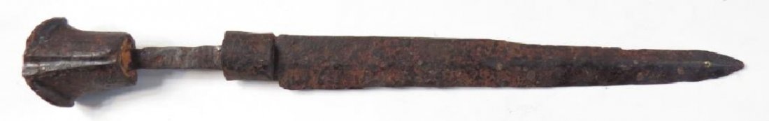 A RARE MEDIEVAL DAGGER: German work, the large, bilobate steel pommel with flared terminals, comparable to those found on Landsknecht weapons, and a faceted bolster. The blade straight, forged flat on the left side, with pro