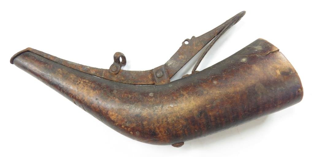 A CAUCASIAN PRIMING FLASK: Well carved of finely-figured striped wood, with steel mounts. Late 18th-early 19th century. Overall length 19cm. Condition II