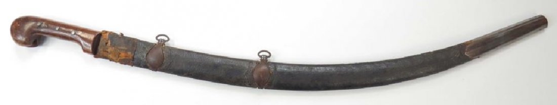 AN UZBEK SABER: With characteristic hilt of figured hardwood, retained by rivets. The heavy blade curved and fullered, likely repurposed from a military sword. In its tooled leather over wood scabbard with steel moun