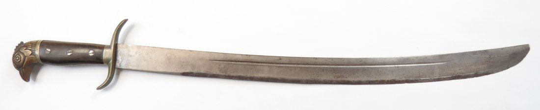 A SPANISH-AMERICAN WAR SHORTSWORD: German maker-marked, eaglehead pommel with recurved guard and horn grips. Heavy, broad, single-edged blade retains much original edge. Overall length 87.4cm. Condition III