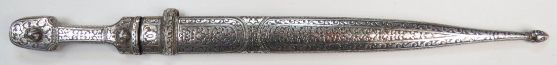A CAUCASIAN KINDJAL DAGGER: Made for a bot or woman, a rare example of Kubachi zarnesh or true-inlay work. The mounts of characteristic form, forged entirely of steel and lavishly inlaid throughout with silver in characteristic