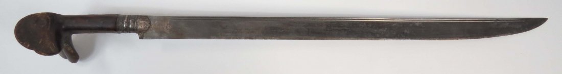 A BALKAN YATAGHAN SWORD: The horn grips with large ears, simple mounts and straight blade incised at the forte with a coat of arms, suggesting Croatian use, probably Pandour. Latter 18th century. Worn. Overall length 74.7cm. 