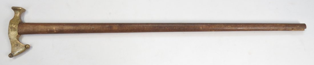 A HUNGARIAN FOKOS AXE: With well-detailed bronze head engraved with the owner’s initials. On its characteristically long hardwood haft. Late 19th century. Light wear. Overall length 74.5cm. Condition III