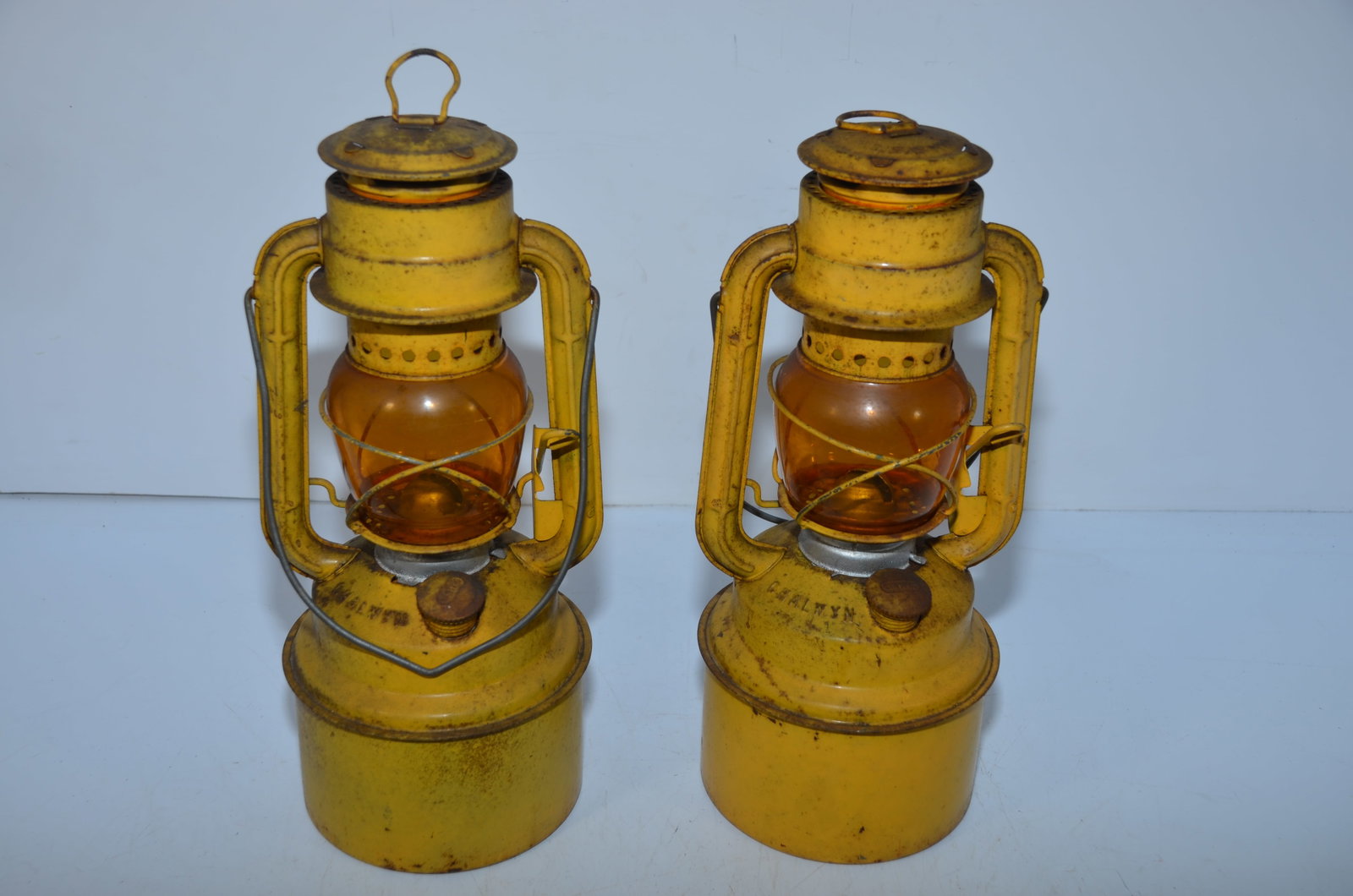 Two Chalwyn Tropic Special Lanterns: This is a pair of Chalwyn Tropic Special lanterns. Both have amber globes, and are cast with TROPIC SPECIAL on their founts. Correct burners, and both have their CHALWYN cast fount caps