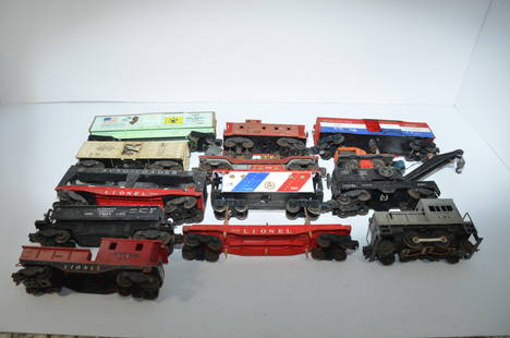 Thirteen Mixed Lionel O scale Cars and Locomotives: This is a lot of 13 mixed Lionel O scale cars and locomotives. They include an automatic refrigerated milk car 3472, autoloader auto rack 6414, automatic dump car 3469, wreck crane 6460, and more