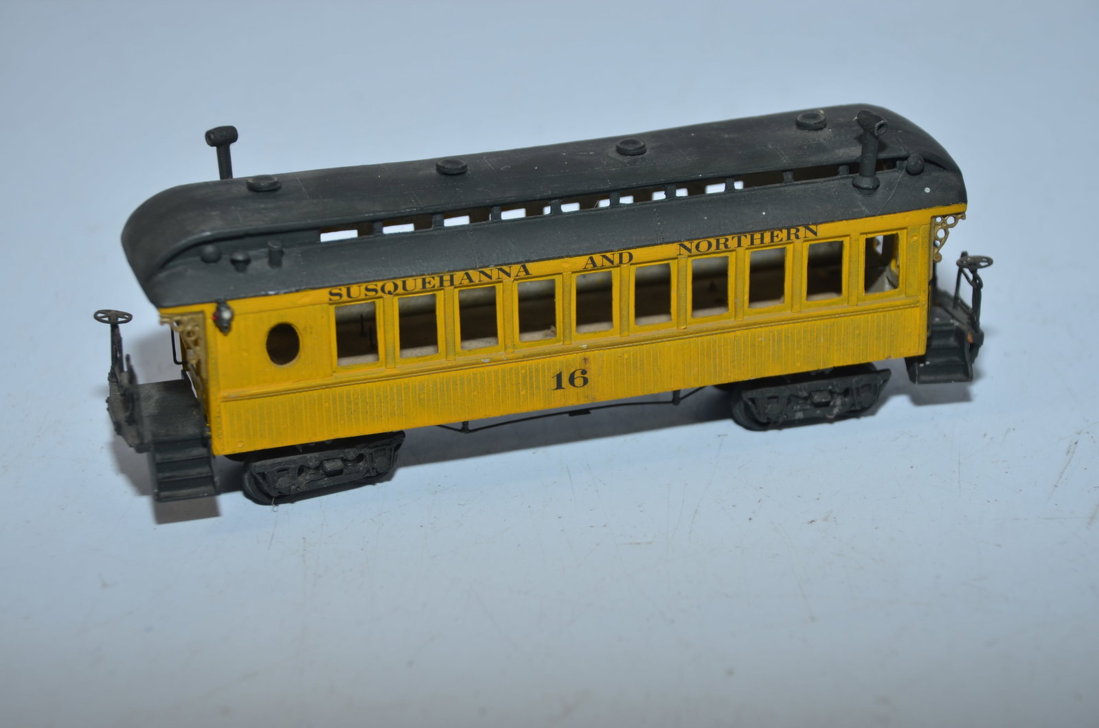 Brass Vintage Susqueheanna and Northern RR Passenger Coach: This is a brass vintage Susquehanna and Northern Railroad passenger car. Unknown manufacturer. Needs couplers and one set of stairs is missing. Well painted and decalled. Comes with a marker lamp on o