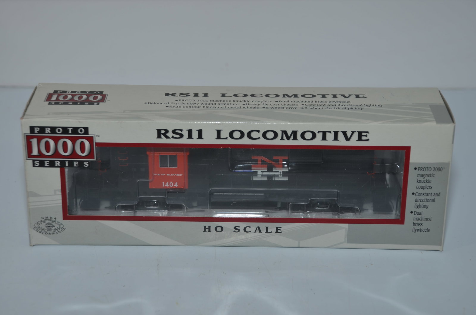 New Haven RR Life-Like Proto 1000 Alco RS-11 DC Diesel Loco #1404-HO Scale: This is a New Haven Railroad Life-Like Proto 1000 Alco RS-11 DC diesel locomotive #1404 in HO scale. It has been tested but will need to be serviced to run well. New in original box.