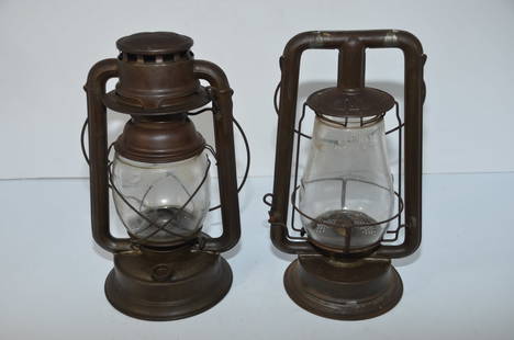 Two C T Ham Tubular Lanterns-Nustyle Cold Blast/#0 Clipper: This is a pair of C T Ham tubular lanterns. The first is a Nustyle Cold Blast, with a plain clear globe, burner, and fount cap. The second is a rare #0 Clipper from October 1898, that has a clear cast