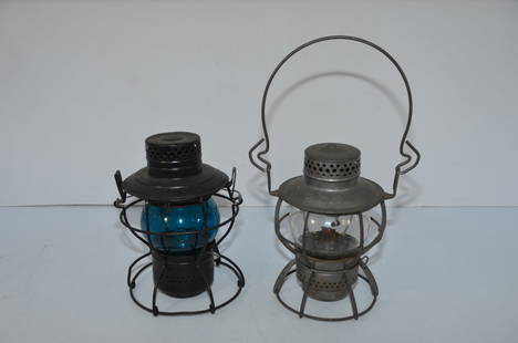 Pair of Pennsylvania Railroad Handlan and Dressel Switchmans Lanterns: This is a pair of switchmans lanterns from the Pennsylvania Railroad. The first is made by Handlan, and has the PRR keystone logo cast into the top of the chimney. It has a green cast Corning CNX glob