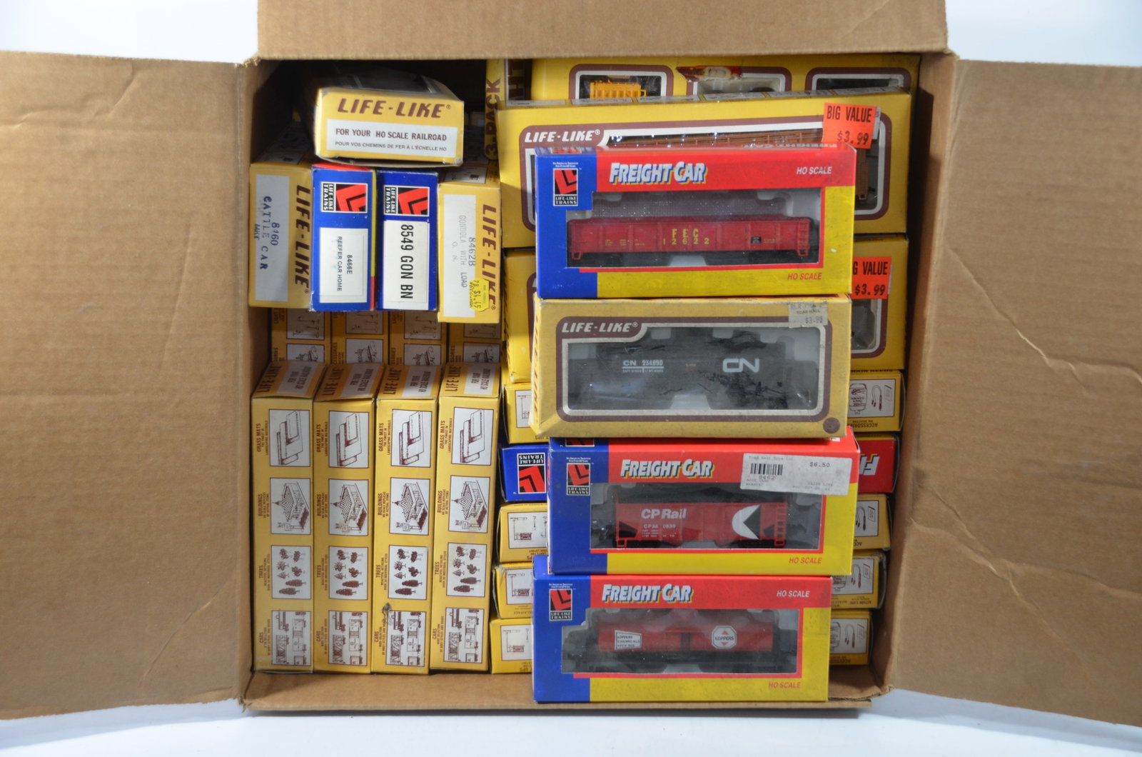 81 Life-Like Freight Cars in Original Boxes-HO Scale-Many are New!: This is a box of 81 mixed HO scale Life-Like freight cars that are in their original boxes. Many, if not most, are new. A great way to stock your hobby shop, or fill out your layout!