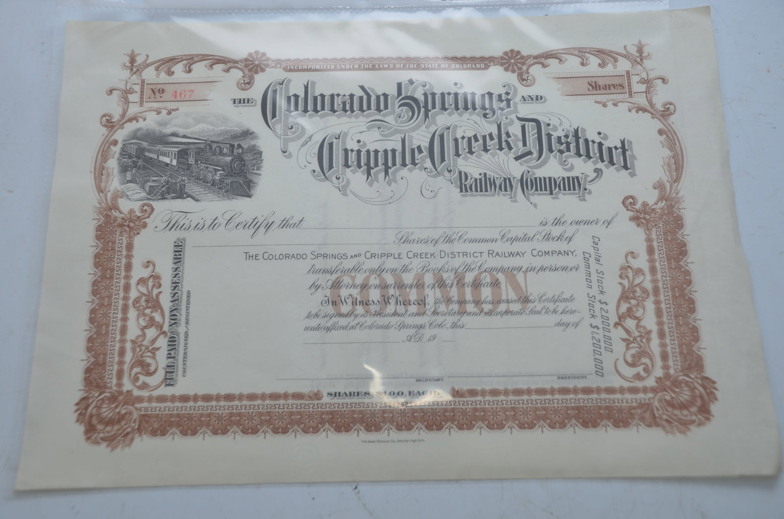 Colorado Springs and Cripple Creek District RY Stock Certificate: This is a Colorado Springs and Cripple Creek District Railway stock certificate. This is the brown version, number 467, and is for $100 shares of common stock in a $1.2 million offering. Hard to find 