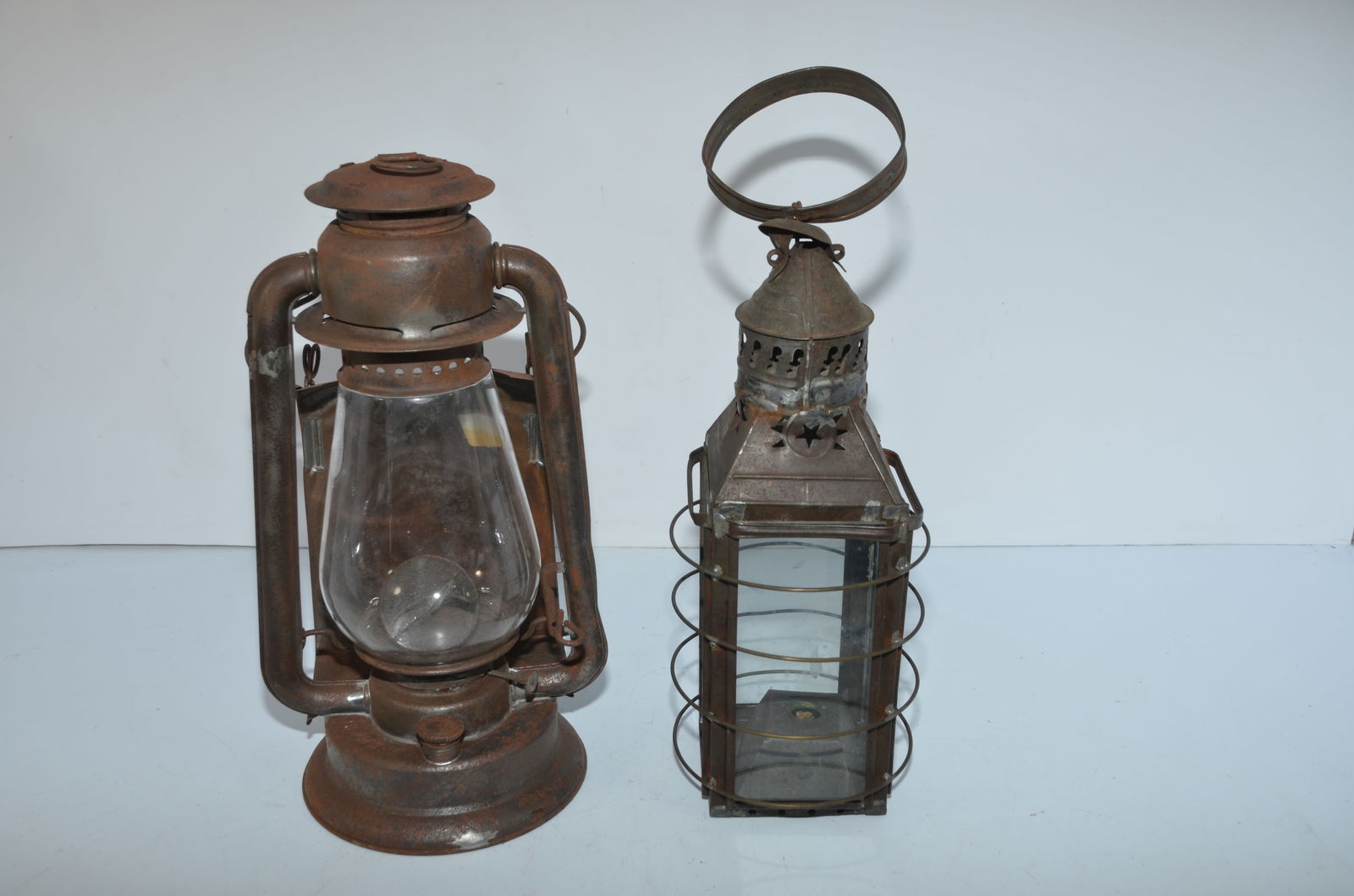 Simmons Liberty and Parkers 1853 Patent Lanterns: This is a pair of rare lanterns. The first is a Simmons Liberty model, and it is also cast with S. H. Co U.S.A. behind the globe. Has a plain clear globe, fount cap, burner, and a bullseye lens that h
