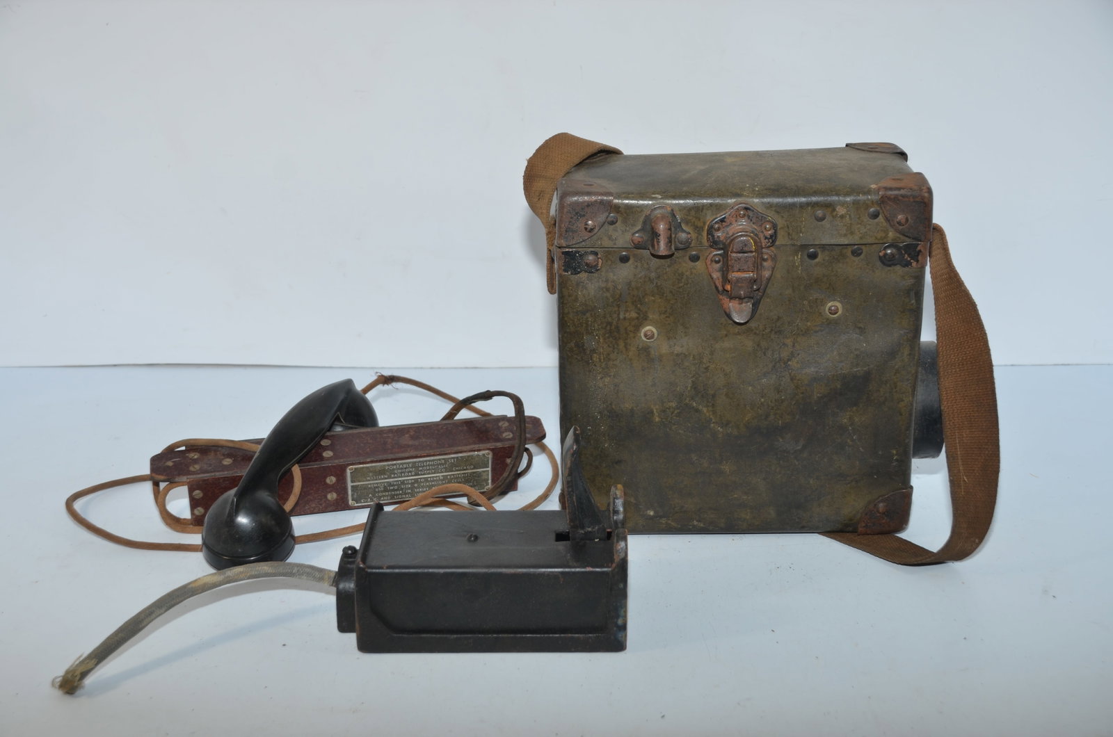Chicago Burlington and Quincy RR Telephone; Other RR Phone Parts: This is a railroad telephone and case from the Chicago Burlington and Quincy Railroad. The wiring diagram is inside the top of the case and the phone and batteries are in the bottom. Also included in 