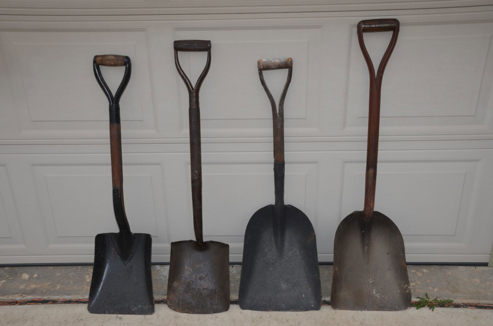 Four RR Coal Shovels-NYC/ERIE/Pittsburg Shawmut and Northern: This is a lot of four railroad coal shovels. There are two from the New York Central Railroad, one from the Erie Railroad, and one from the Pittsburg Shawmut and Northern Railroad. All are in fine use