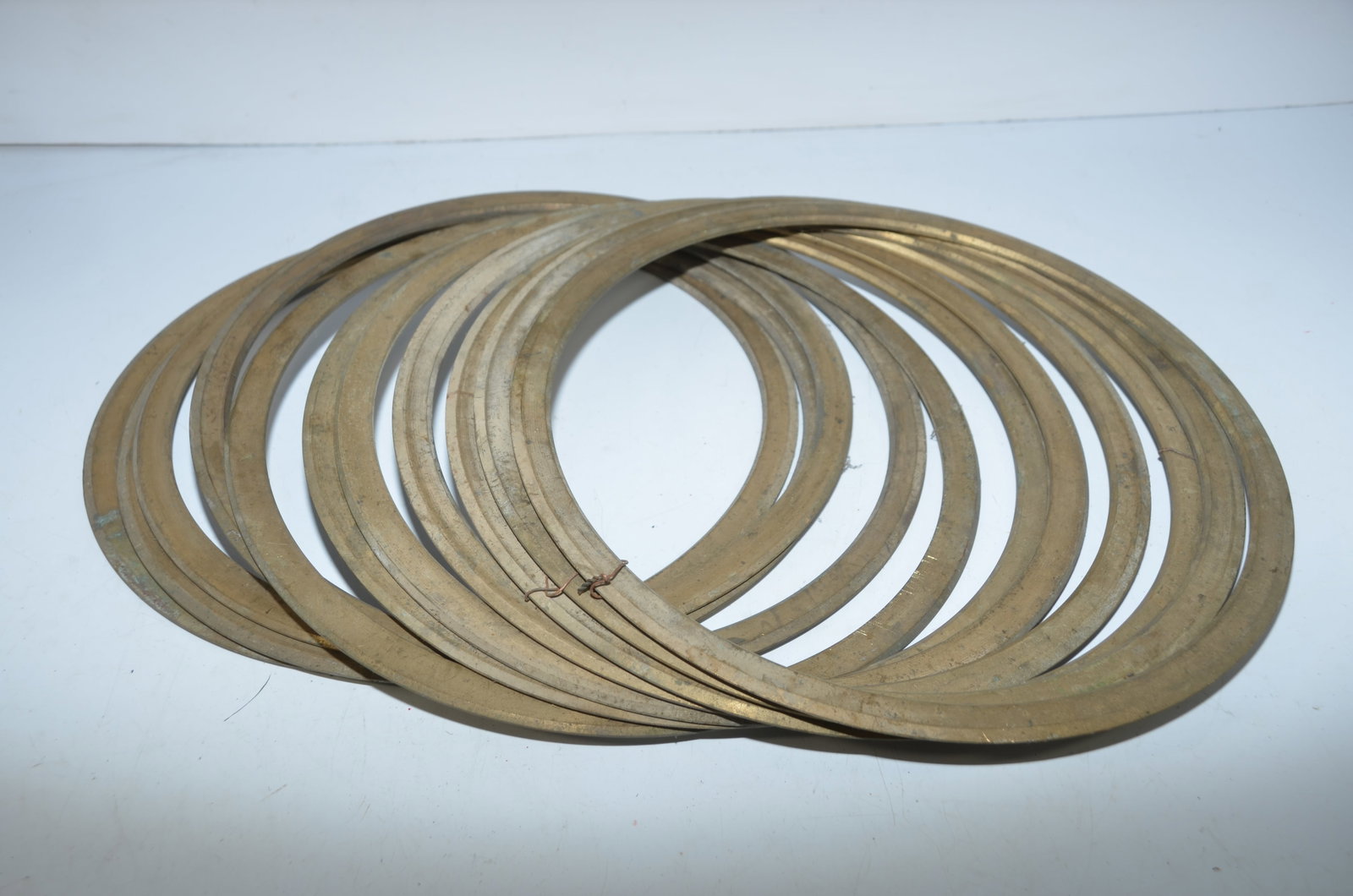 Eleven New Brass RR Locomotive Piston Rings: This is a lot of 11 new brass piston rings for diesel railroad locomotives. Inside diameter is 12 inches; outside diameter is 13.75 inches. Great for a museum restoring locomotives to operating condit