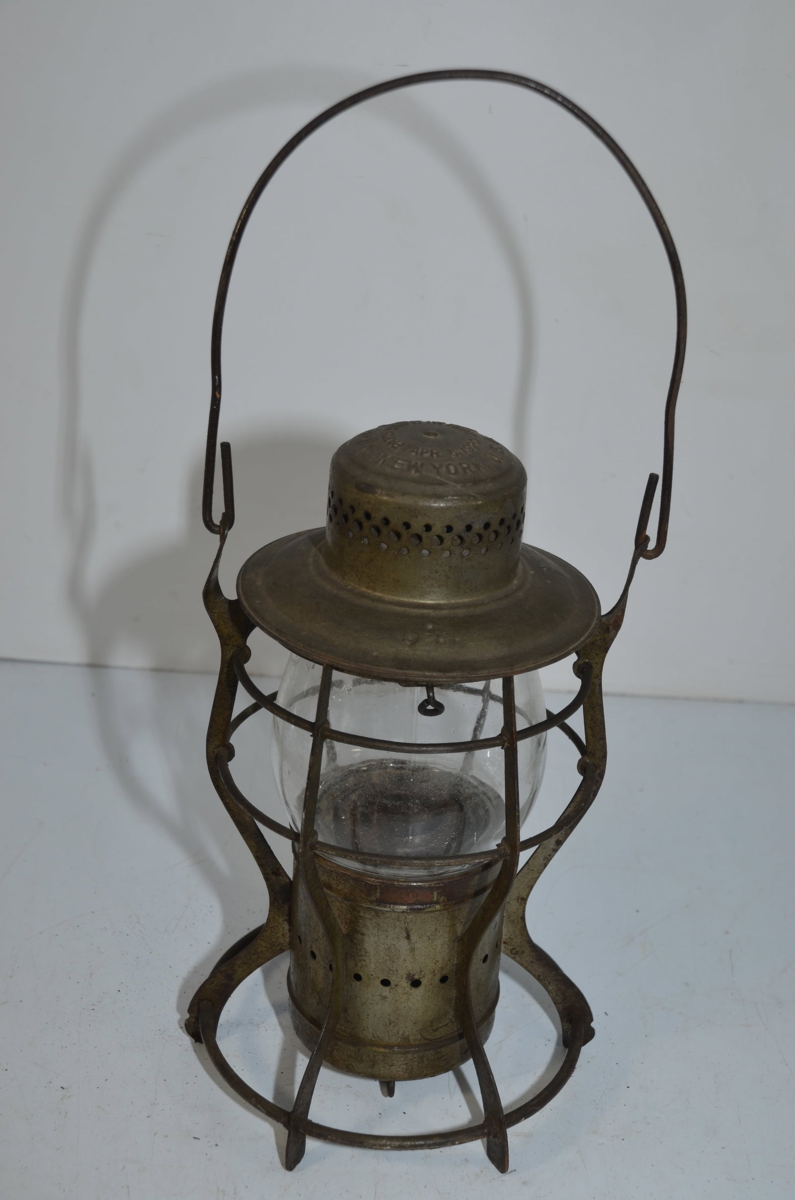 V&N Lantern Company RR Lantern: This is a V&N Lantern Company railroad lantern. Cast with V&N LANTERN USA on the chimney, it has a patent date of 1907 and 1920 on the chimney as well. Has a clear cast Dietz Vulcan extended base glob