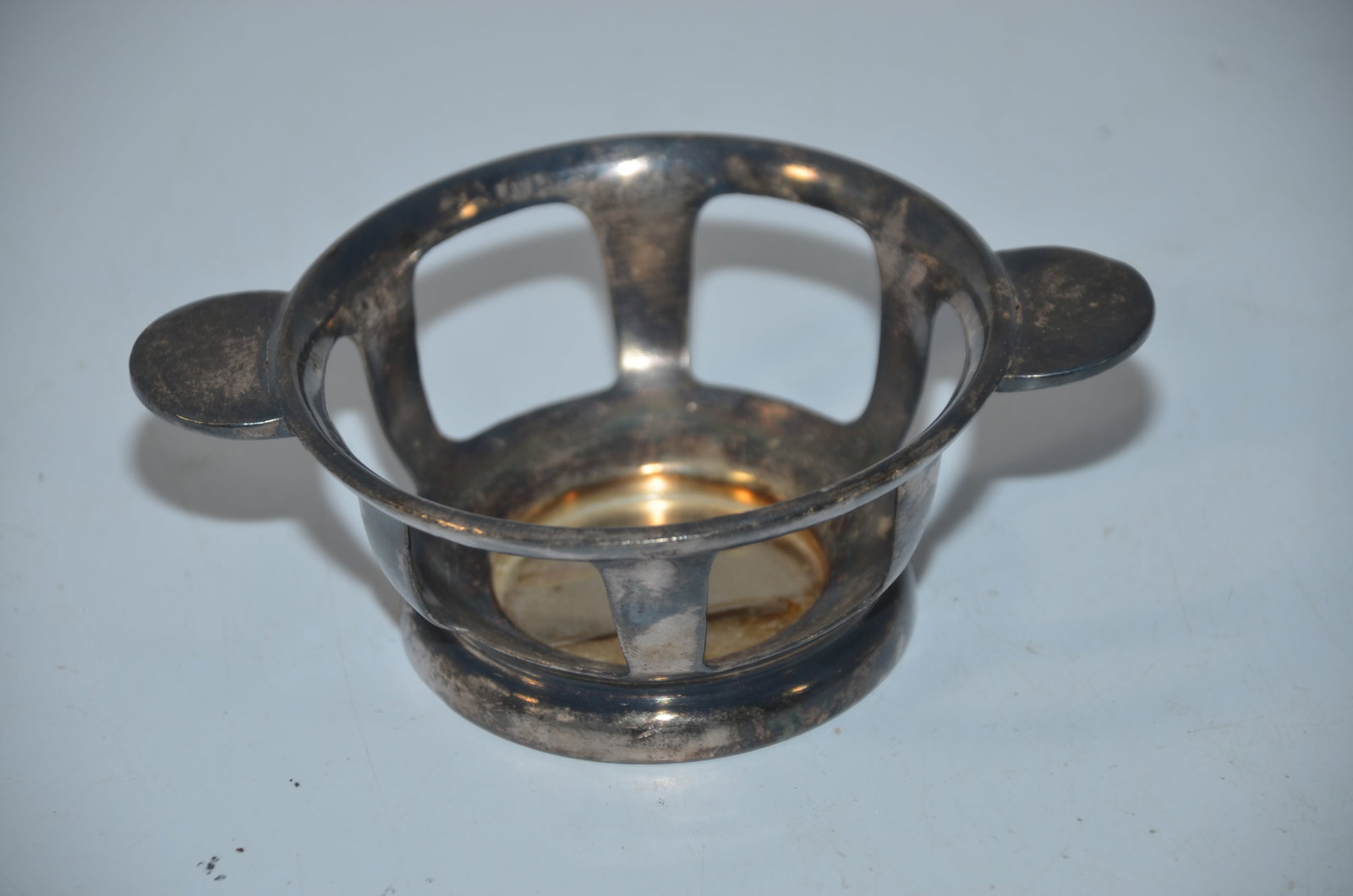 Great Northern RY Silver Soup Bowl Holder: This is a Great Northern railway silver soup bowl holder. Made by the International Silver Company and stamped with GREAT NORTHERN RY on the bottom. Measures 5.5 inches by 4 inches and is 2 inches in 