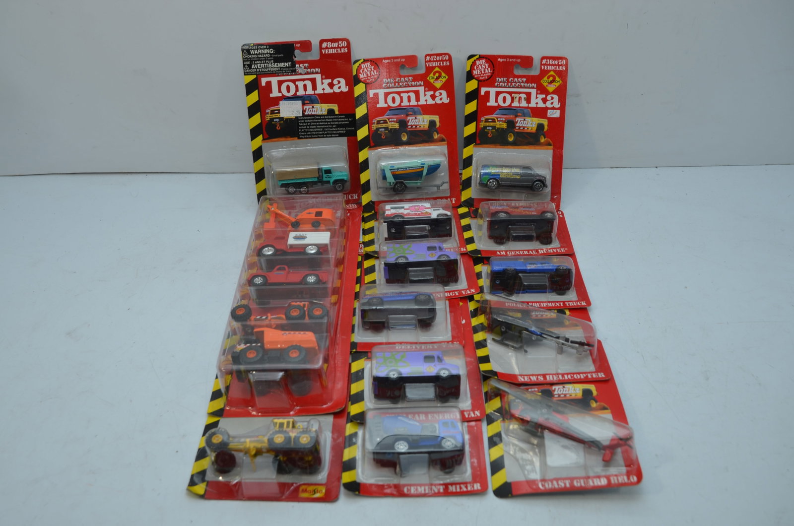18 Tonka Die Cast Trucks, Boats and Helicopters: This is a lot of 18 Tonka die cast trucks, boats and helicopters. All are new in their original packaging.