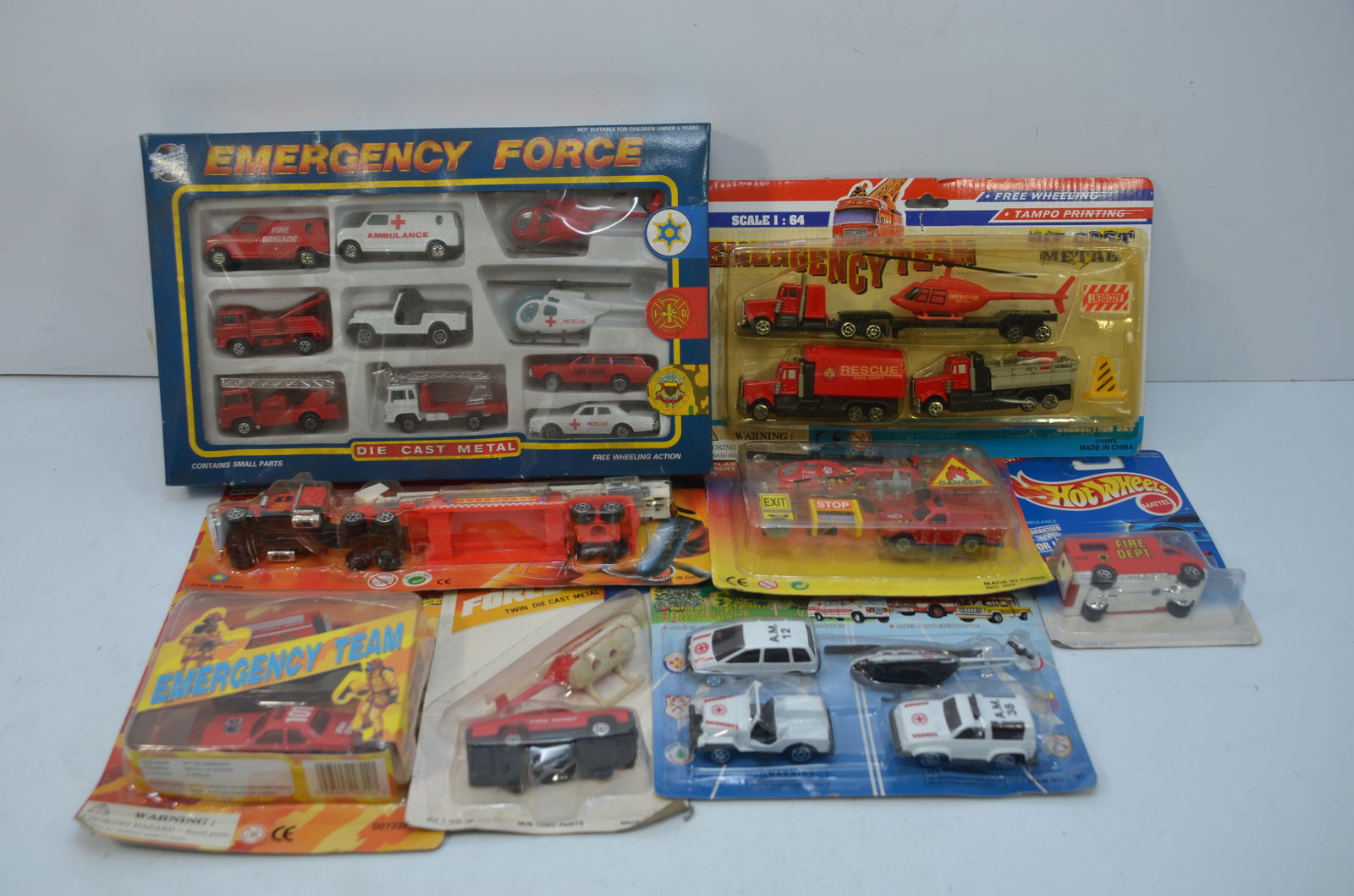 25 Assorted Die Cast Police, Fire, and Rescue Vehicles: This is a lot of 25 die cast police, fire, and rescue vehicles. Hot Wheels and other manufacturers are represented. All are new in their original packaging.