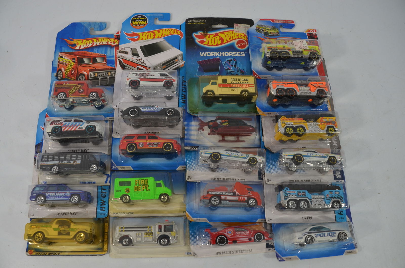 21 Hot Wheels Police Fire and Rescue Vehicles-New on Card-Lot 1: This is a lot of 21 Hot Wheels police, fire, and rescue vehicles that are all new-on card. See photos for details.