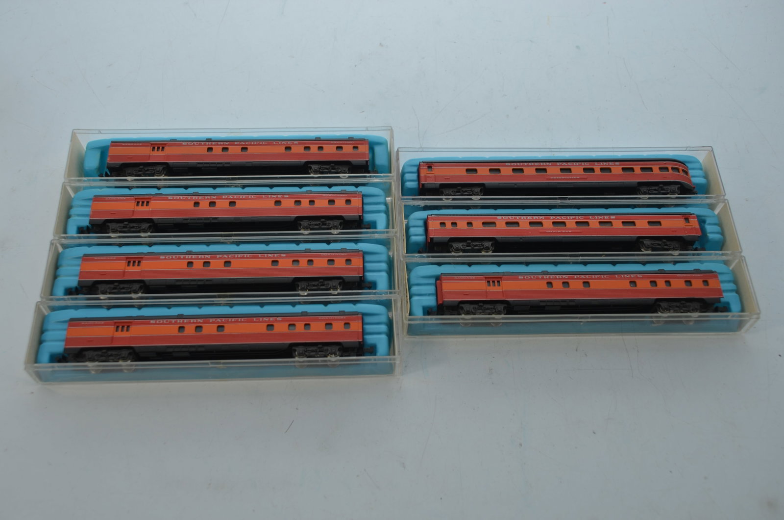 Seven Southern Pacific RR N Scale Illuminated Passenger Cars-Atlas: This is a lot of seven Southern Pacific Railroad illuminated passenger cars in N scale, all made by Atlas, that are new in their original boxes. Includes baggage/dormitory cars, a coach, and an observ