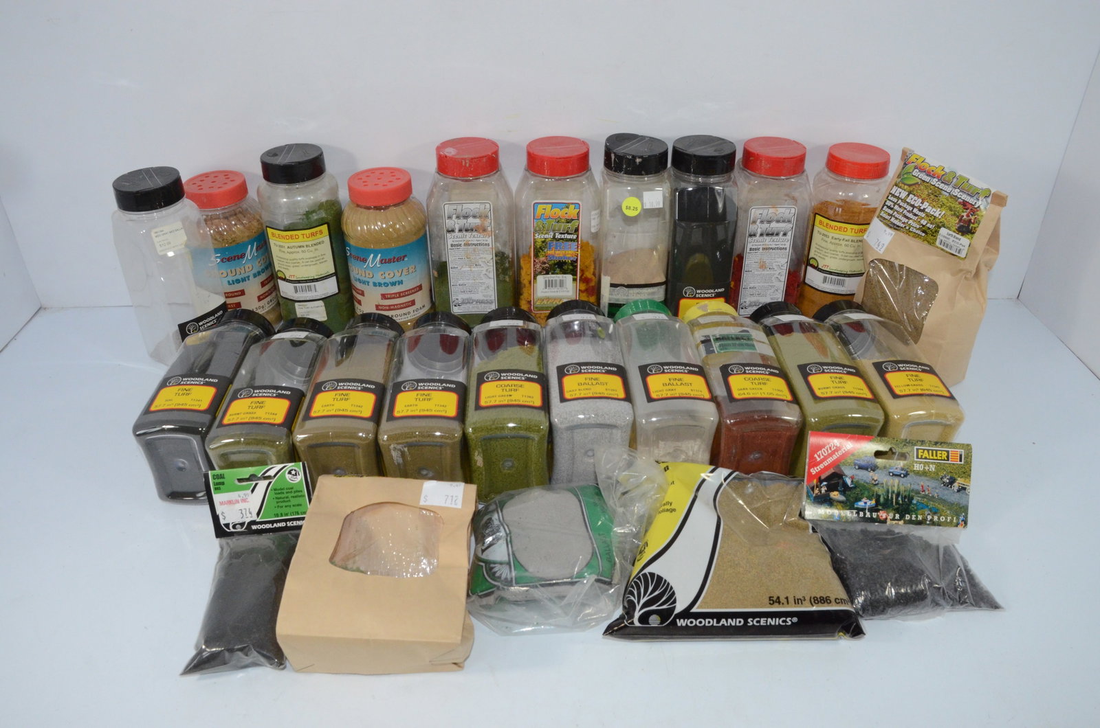 Ground Foam and Ballast Scenery Lot-Multi Scale: This is a lot of ground foam and ballast for making scenery on any scale of layout. There are 26 total jars or bags of scenery material. Some are full, some are only partials, but there is a LOT of go