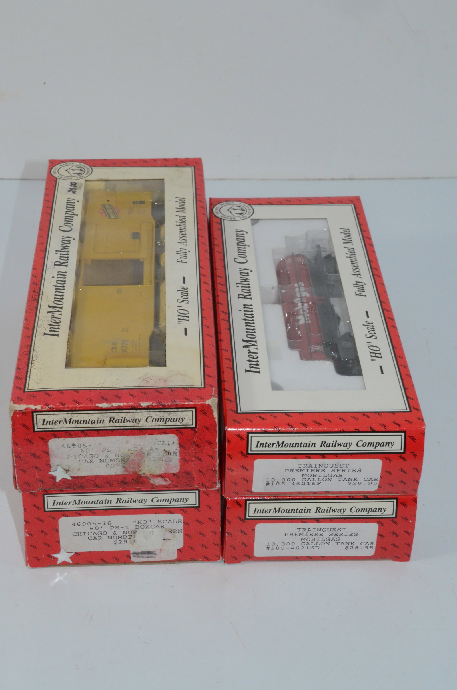 CNW 60 Foot Boxcar/Mobil 10K Gal Tank Car 4 Car Set-Intermountain-HO Scale: This is a 4 car set of that includes two Chicago and Northwestern Railroad 60 foot PS-1 boxcars and two Mobilgas 10,000 gallon tank cars in HO scale. These are manufacturer numbers 46905-14 and 16, as