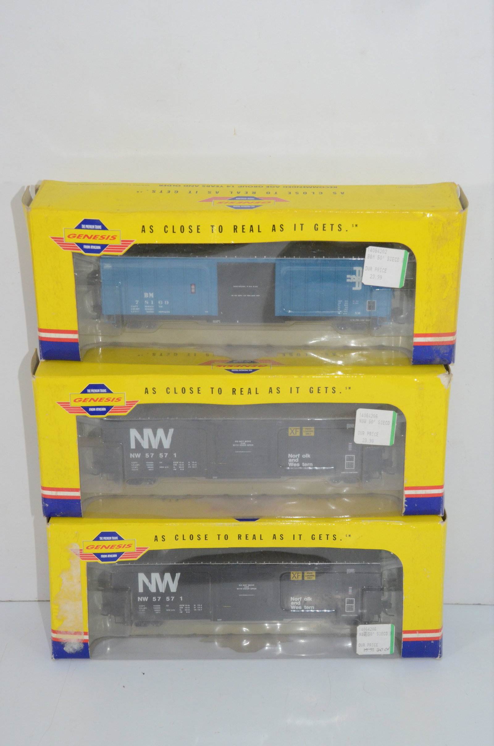 Norfolk and Western/Boston and Maine-3 Athearn Genesis 50 Foot Sieco Boxcars: This is a lot of 3 Athearn Genesis 50 foot Sieco boxcars, new in the original boxes. The boxes are a little worn, but the cars are excellent. There are two Norfolk and Western Railroad cars and one fr