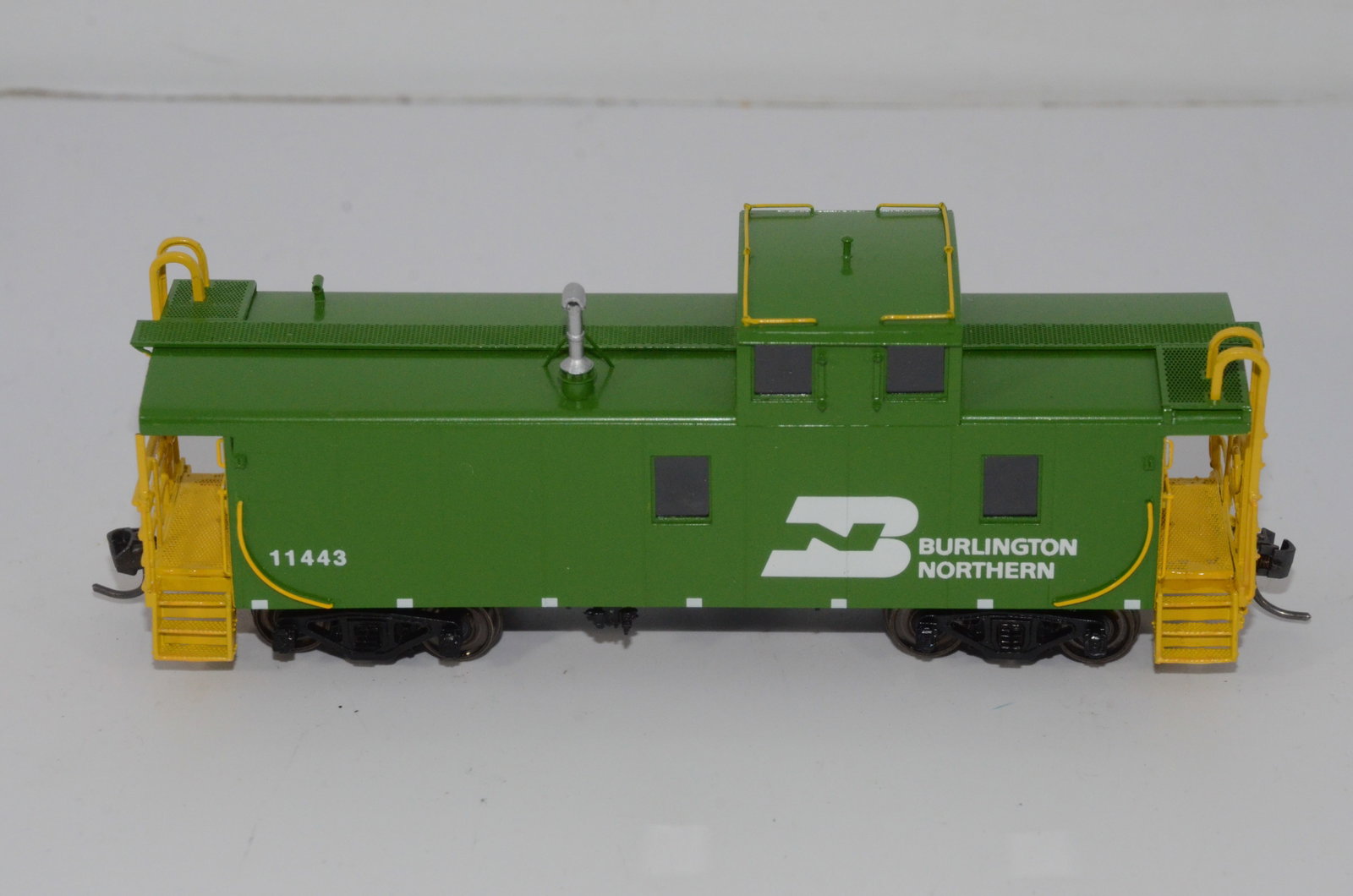 Burlington Northern RR Steel Caboose-Overland Brass Models-HO Scale: This is a Burlington Northern Railroad steel caboose #11443 in HO scale. Manufactured in Korea by Ajin Precision and distributed by Overland Brass Models. New in the original box.