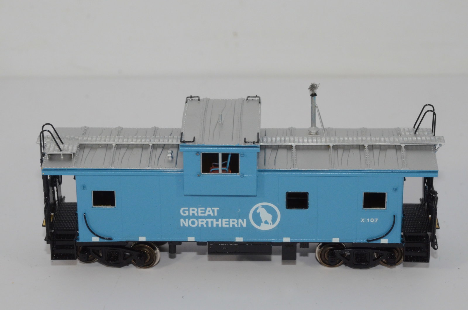 Great Northern RR International Wide Vision Caboose-Overland Brass-HO Scale: This is a Great Northern Railroad brass International wide vision caboose #X-107 in HO scale. Made by Ajin Precision in Korea and distributed by Overland Brass Models. New in the original box.