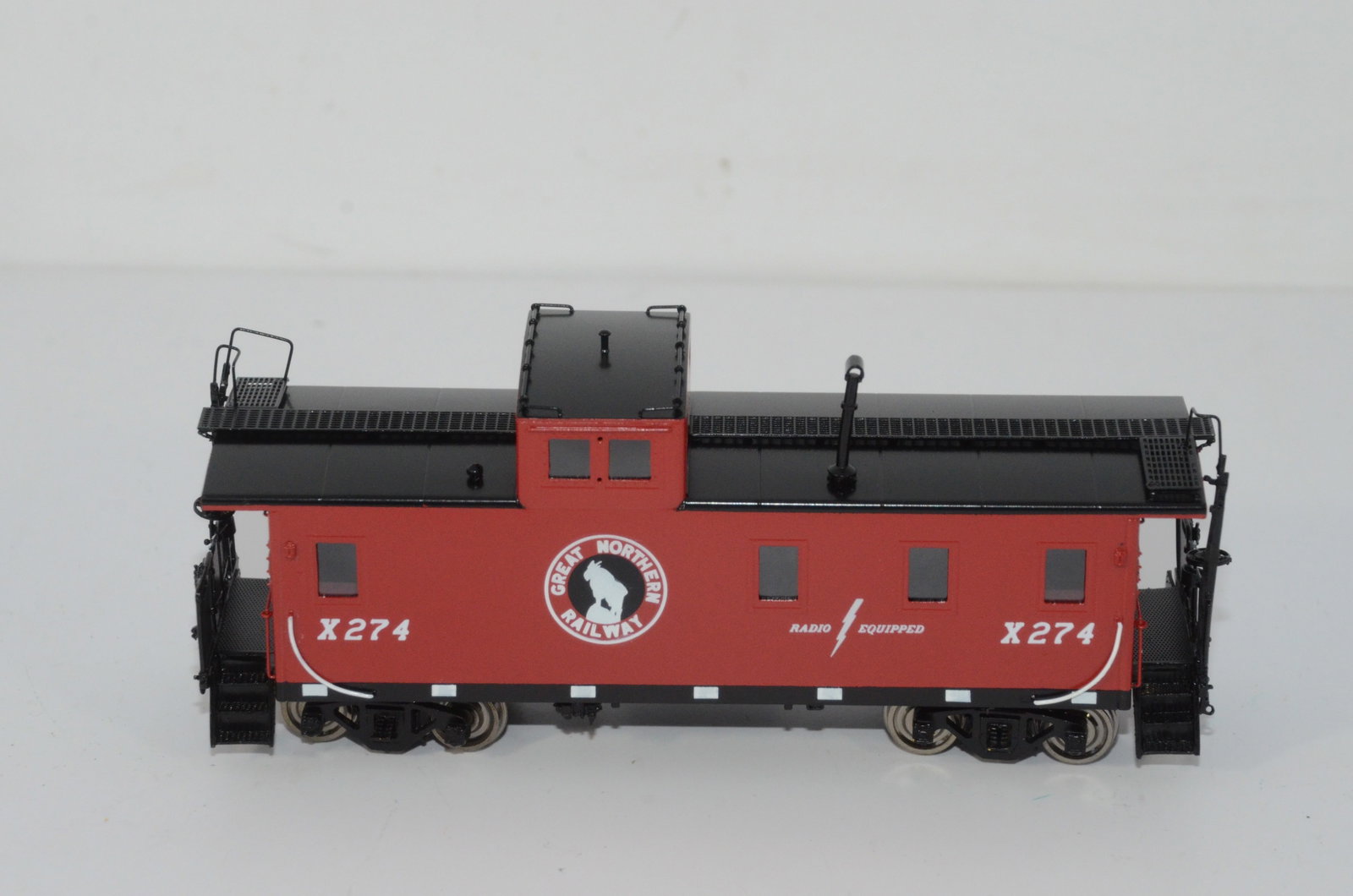 Great Northern RR Steel 1945 era Caboose-Overland Brass Models-HO Scale: This is a Great Northern Railroad brass steel 1945 era plyw2ood caboose #X274 in HO scale. Made by Ajin Precision in Korea and distributed by Overland Brass Models. New in the original box.