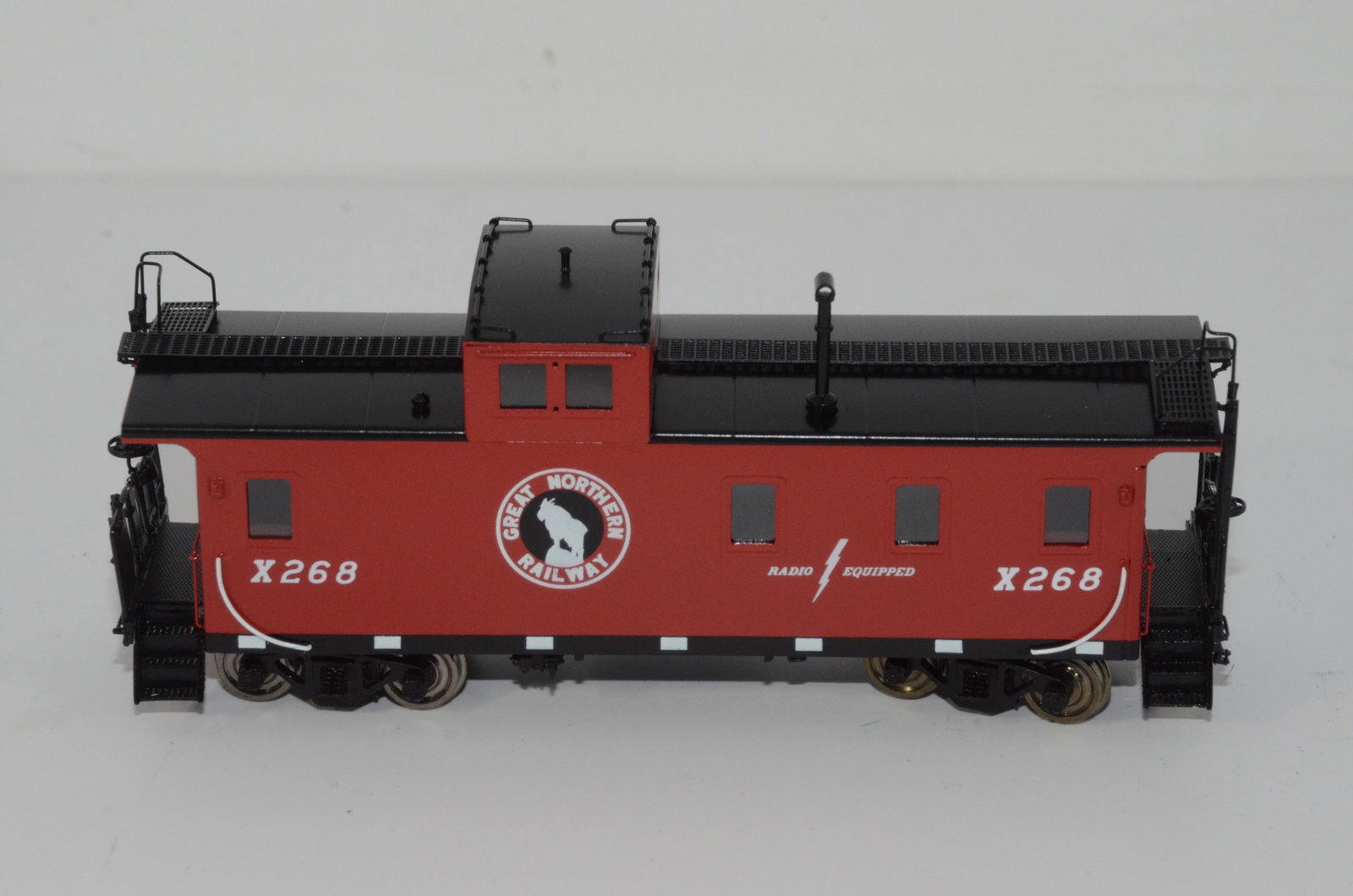 Great Northern RR Steel 1945 era Caboose-Overland Brass Models-HO Scale: This is a Great Northern Railroad brass steel 1945 era plywood caboose #X268 in HO scale. Made by Ajin Precision in Korea and distributed by Overland Brass Models. New in the original box.