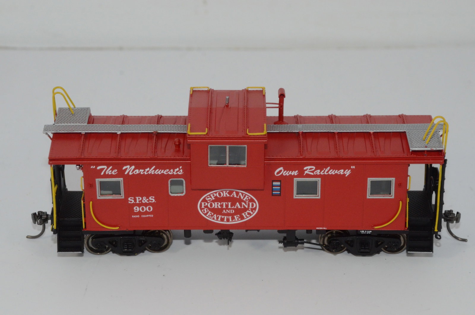 Spokane Portland and Seattle RR International WV Caboose-Overland Brass-HO Scale: This is a Spokane Portland and Seattle Railroad International wide vision caboose #900 in HO scale. Manufactured by Ajin Precision in Korea and distributed by Overland Brass Models. New in the origina