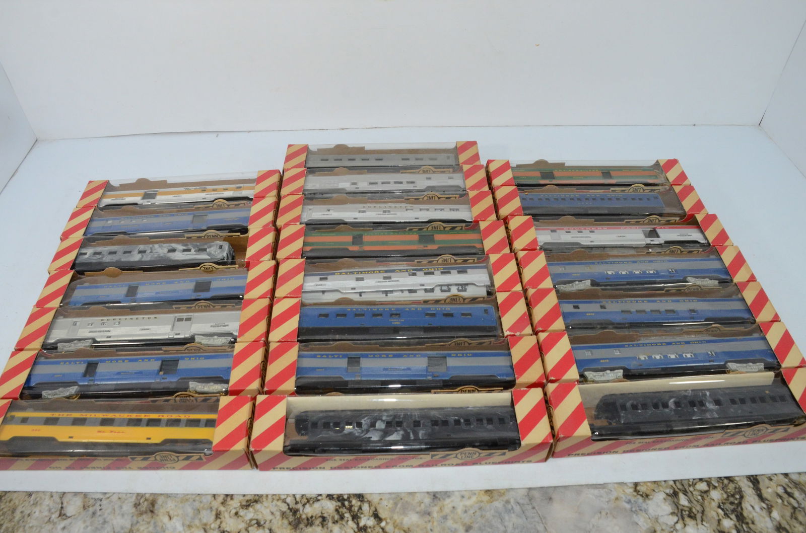 27 Penn Line Passenger Cars and Shells with Penn Line Boxes-HO Scale: This is a lot of 27 Penn Line passenger cars and shells in HO scale. All come is Penn Line boxes. Box label may or may not be accurate. Some are complete cars; some are shells only. DRGW, B&O, CBQ, MI