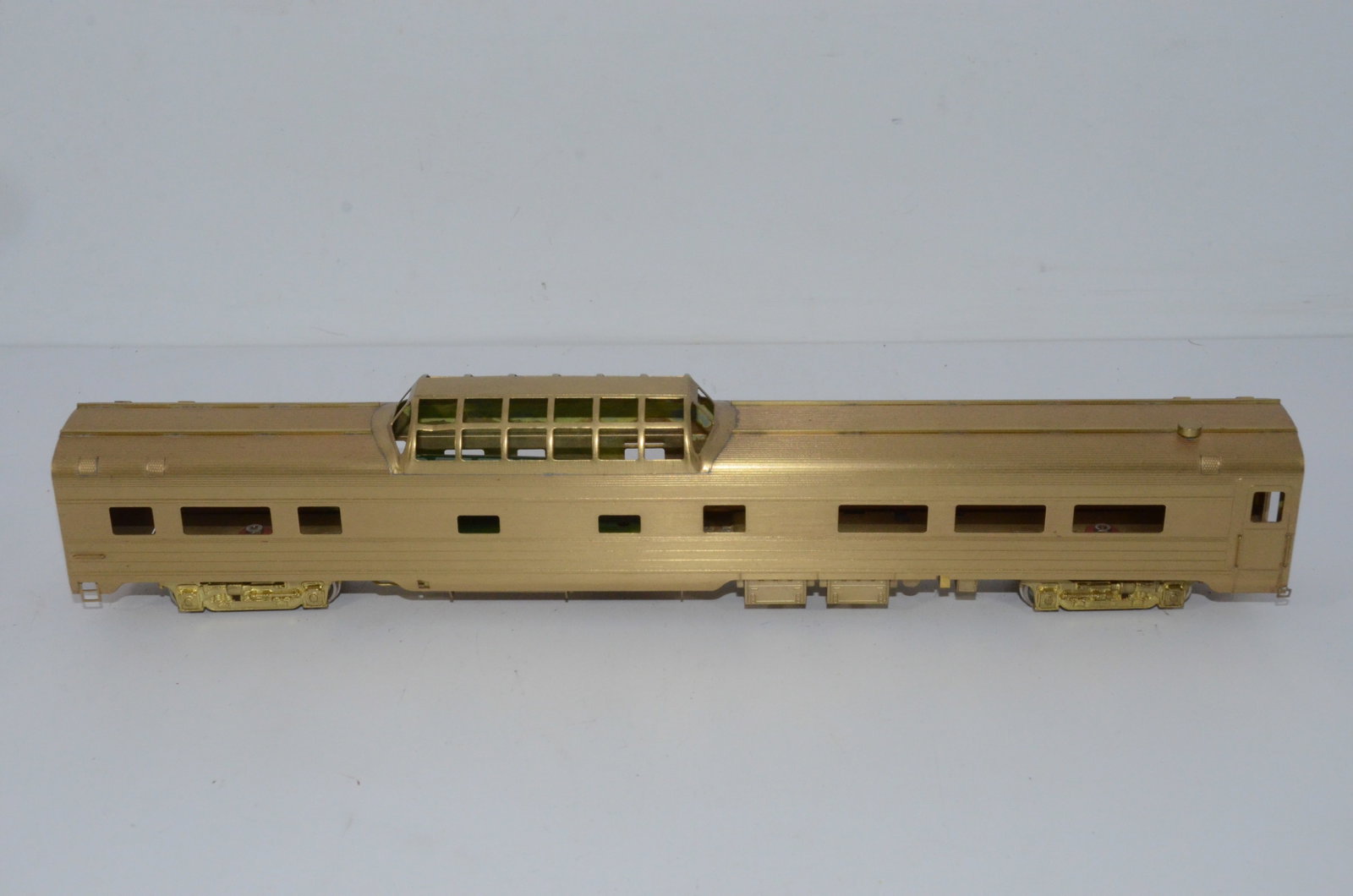 Brass Dome Car-Overland Brass Models-HO Scale: This is a brass dome car in HO scale. The plastic window material for the dome is inside the car. Manufactured by Ajin Precision in Korea and distributed by Overland Brass Models. New, but not in the 