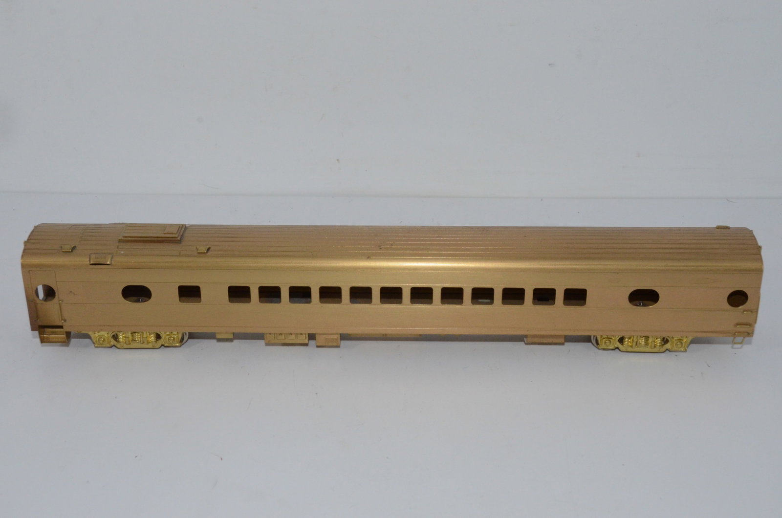 Milwaukee Road RR Coach Car-HO Scale: This is a Milwaukee Road Railroad brass coach car in HO scale. Unknown manufacturer. Looks to be new, but we are listing it as used. Does not come with its original box.