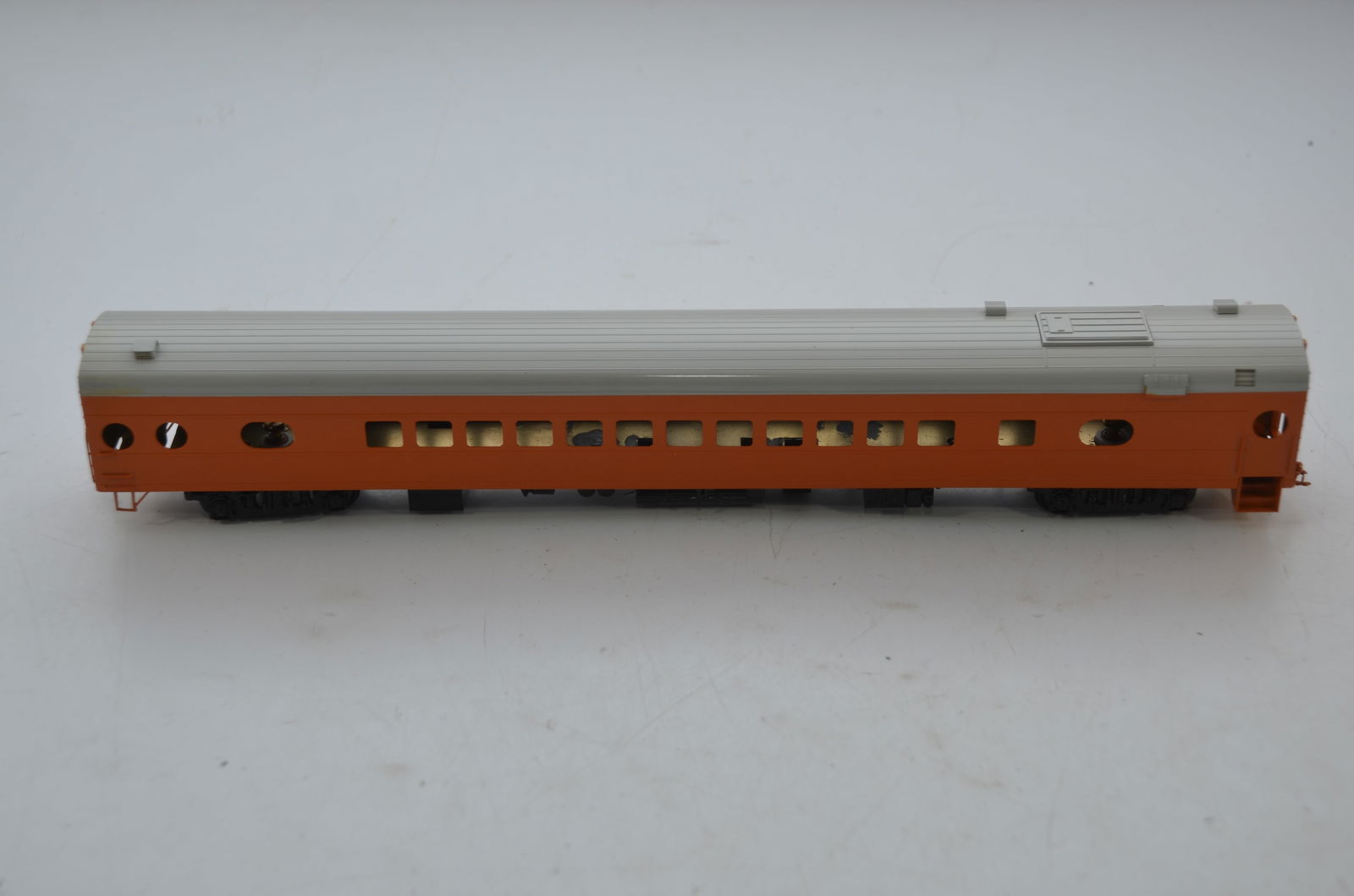Milwaukee Road RR Twin Cities Hiawatha Coach-Oriental Ltd Brass Models: This is a Milwaukee Road Railroad brass Twin Cities Hiawatha coach in HO scale. Painted in the orange and gray scheme and ready for decaling and final assembly. New in the original box. Made in Korea