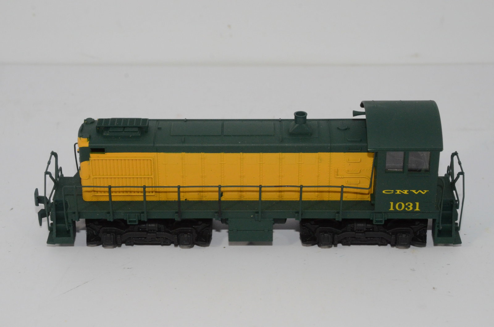 Chicago and Northwestern RR Alco S2 Diesel Locomotive-Atlas-HO Scale: This is an Chicago and Northwestern Alco S2 diesel locomotive #1031 in HO scale. Made by Atlas, it has been tested and runs well. Used, and does not come in its original box.