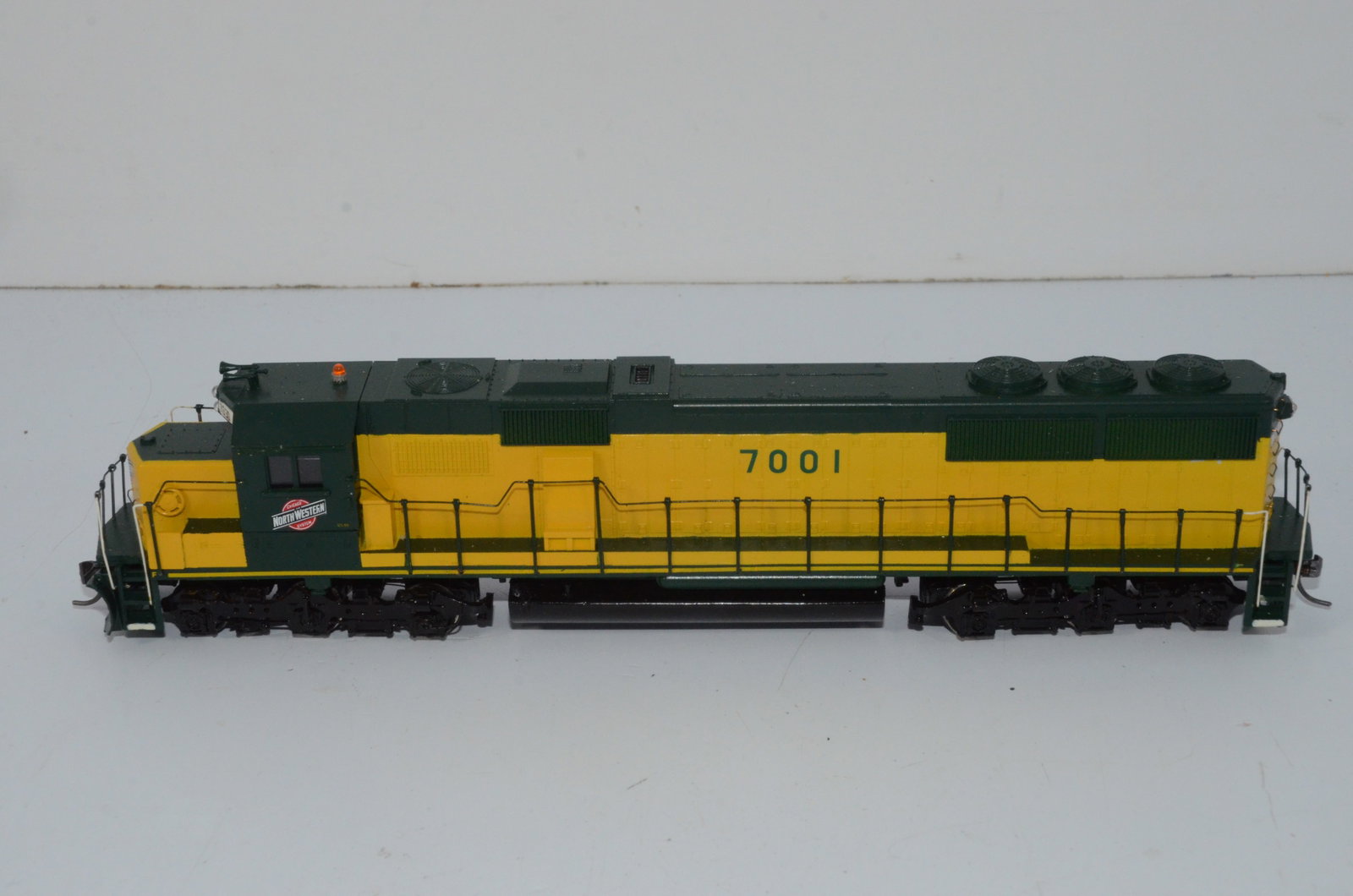 Chicago and Northwestern RR SD50 Diesel Locomotive #7001-HO Scale: This is a Chicago and Northwestern Railroad SD50 diesel locomotive #7001 in HO scale. Custom painted and decalled plastic shell by Lochmann Trains, it comes with an Ajin Precision drive from Korea. Te