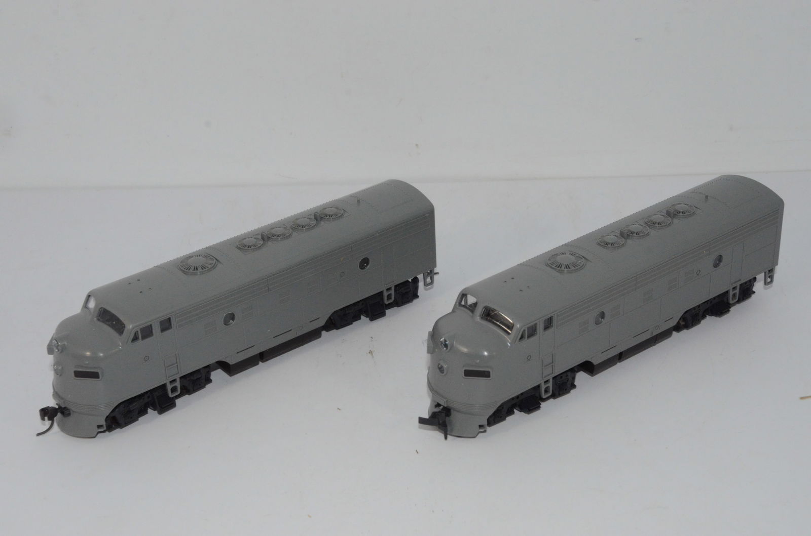 Stewart Hobbies F9A Diesel Locomotive Undecorated Pair-HO Scale: This is a pair of undecorated F9A diesel locomotives in HO scale, made by Stewart Hobbies. Each has a Kato drive/chassis. We are listing them as used, though they look to be new in the original boxes.