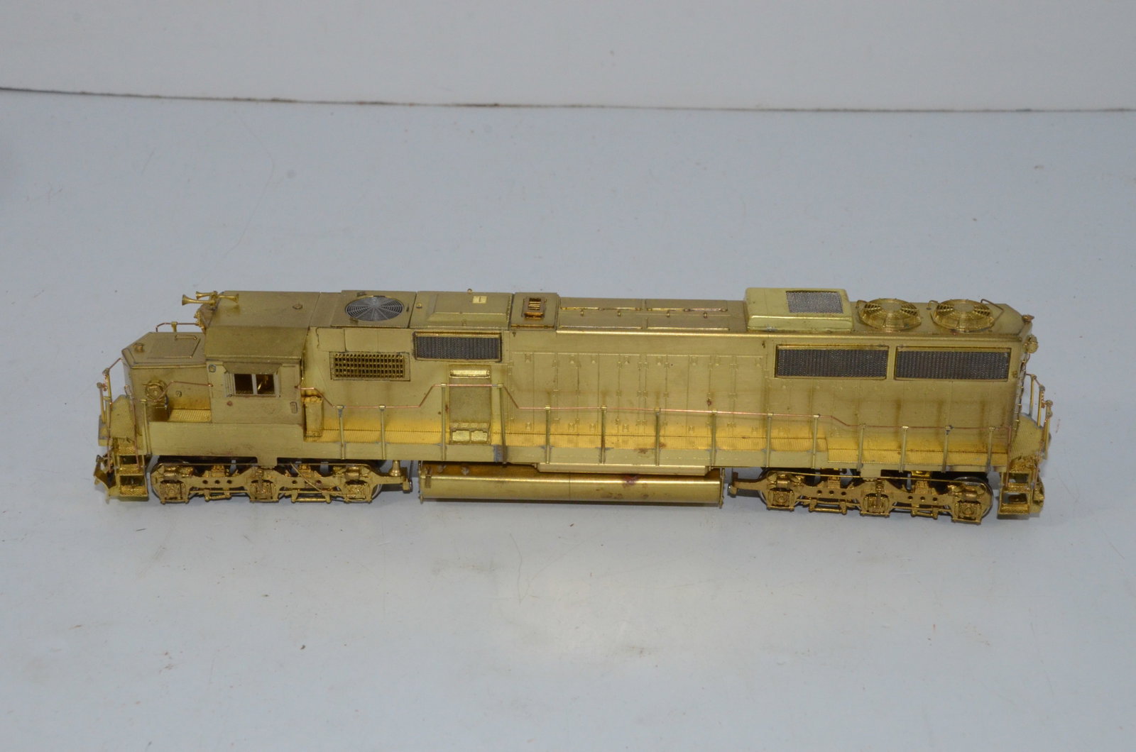 SD60 Diesel Locomotive-HO Scale-Overland Brass Models: This is an SD60 brass diesel locomotive in HO scale, made by Ajin Precision in Korea and distributed by Overland Brass Models. New, but does not come with the original box. Tested and runs well.
