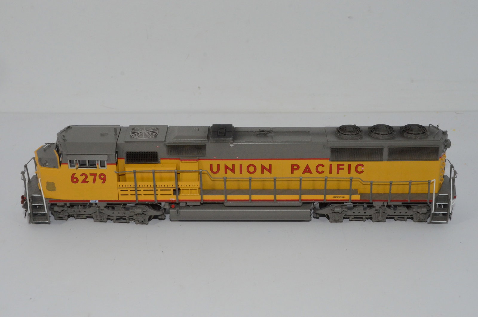 Union Pacific RR SD60M Diesel Locomotive-Overland Brass Models-HO Scale: This is a Union Pacific Railroad SD60M brass diesel locomotive #6279 in HO scale. Manufactured in Korea by Ajin Precision and distributed by Overland Brass Models. Used, and not in the original box. T