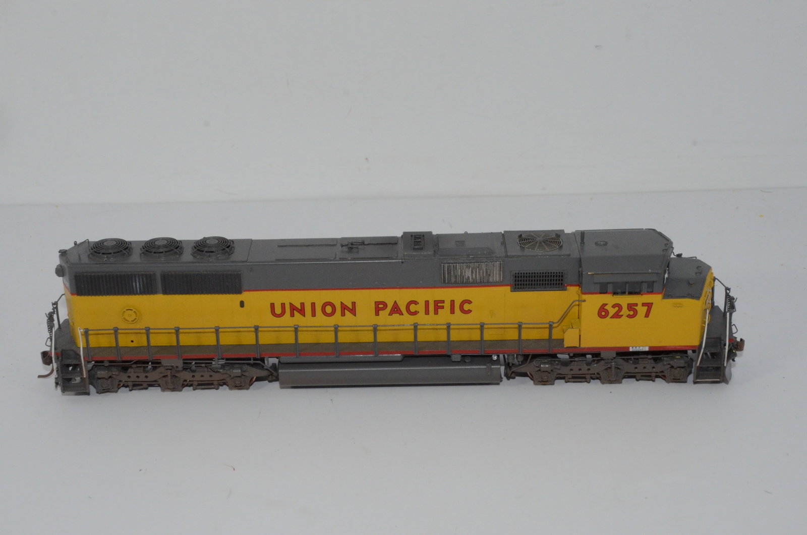 Union Pacific RR SD60M Diesel Locomotive-Overland Brass Models-HO Scale: This is a Union Pacific Railroad SD60M brass diesel locomotive #6257 in HO scale. Manufactured in Korea by Ajin Precision and distributed by Overland Brass Models. Used, and not in the original box. T