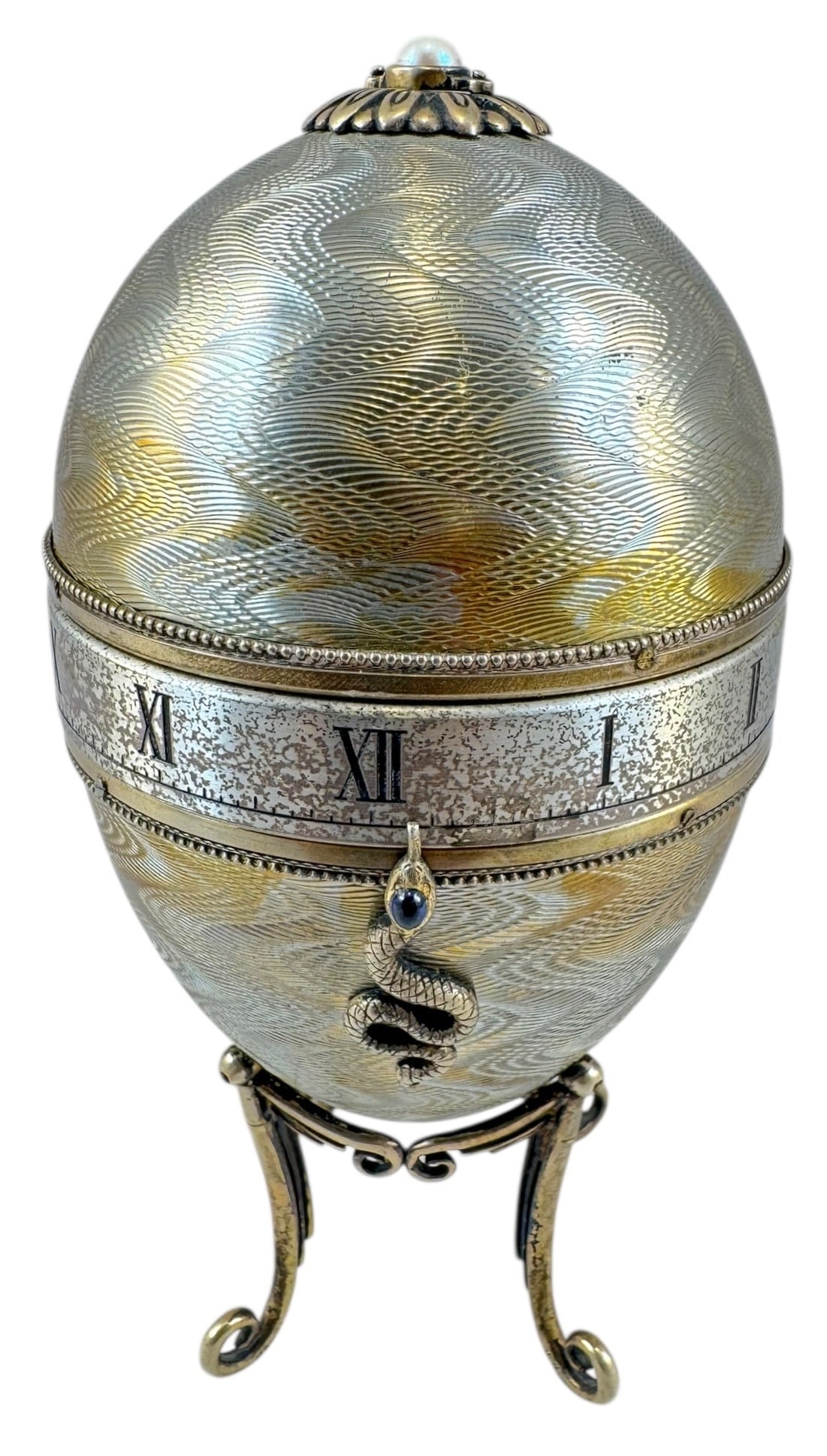 Antique Fine Hand Made Stirling Silver Egg Clock in Homage to Faberge Designed Circa 1980: Antique Fine hand made English Stirling silver egg clock in homage to Faberge designed at the famous world renowned Silvermiths and designer Robert Glover clock has a 8 day single train movement all r